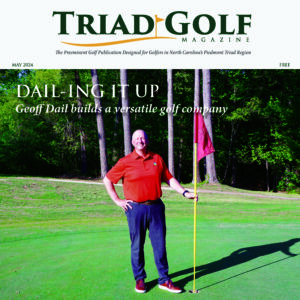 The cover of a magazine featuring a man standing on a golf course